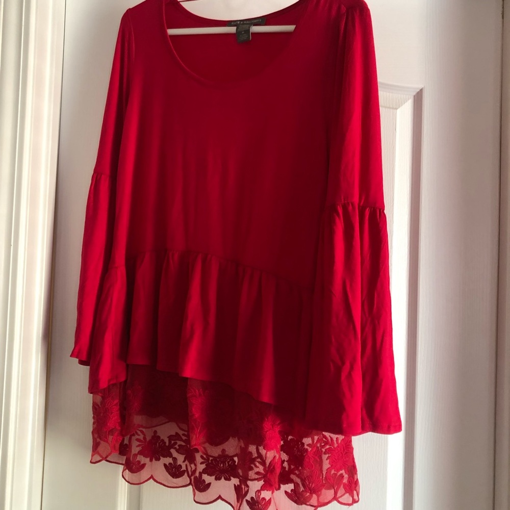 Large red top with beautiful lace around the bottom border.